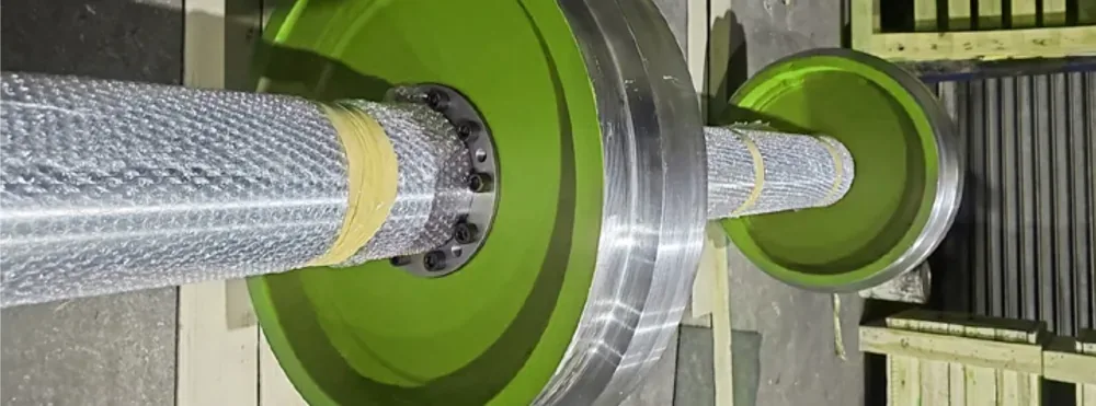 A large lagged pulley being finished
